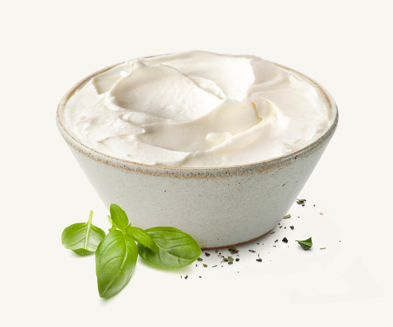 queso-crema-clasico Pote de queso crema acompañado de hojitas de albahaca y orégano seco
