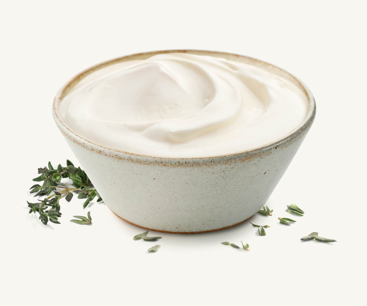 queso-untable-clasico Pote de queso untable clásico, acompañado de tomillo fresco